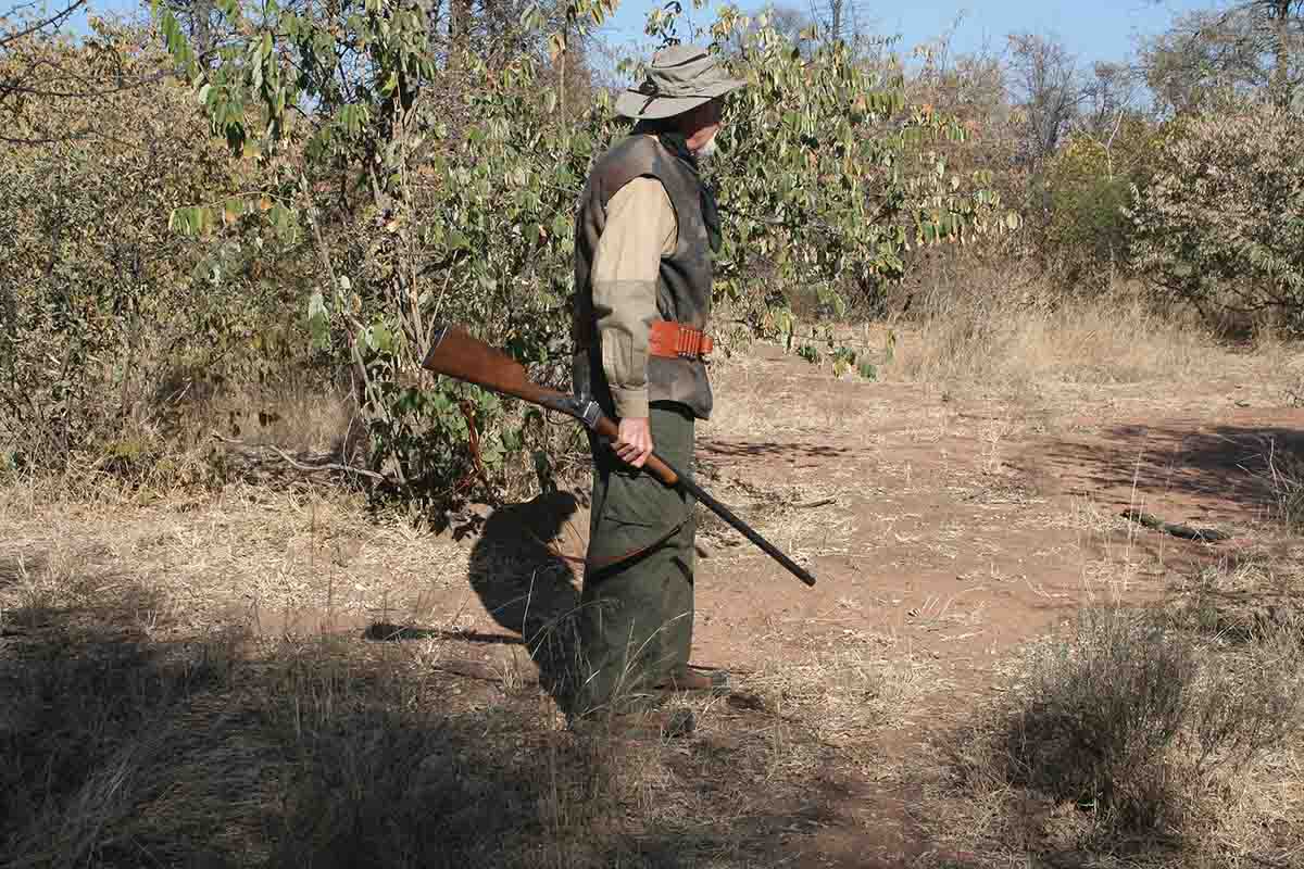 The author, with a Sharps ’74 .45-70, in the African bushveld. Abundant rainfall in May kept the bushveld in full foliage in June.